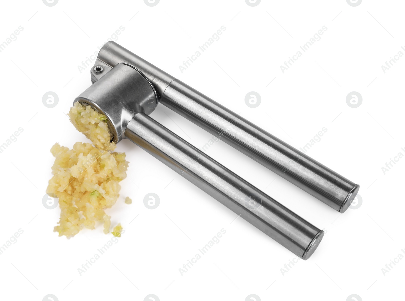 Photo of One metal press and crushed garlic isolated on white