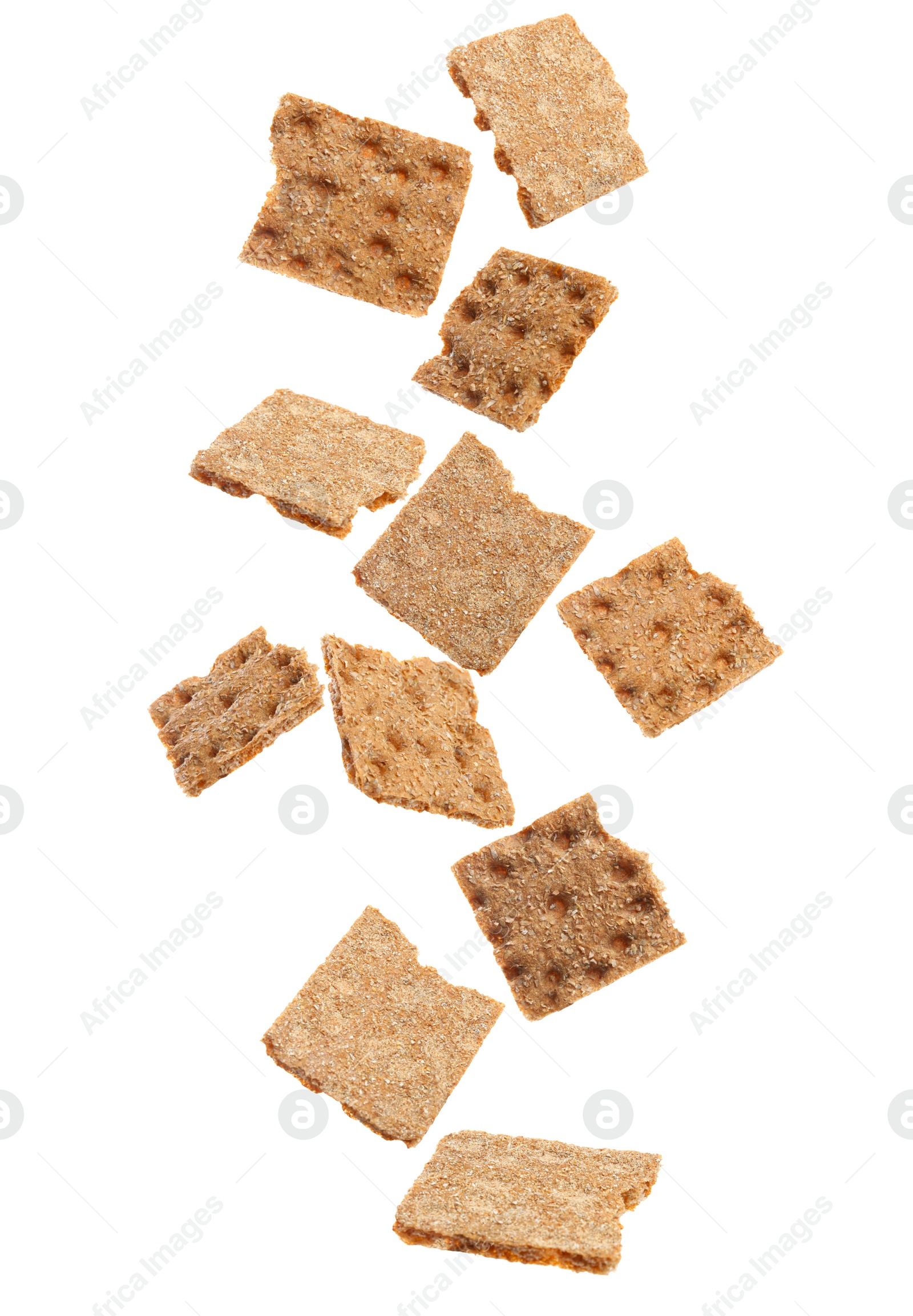 Image of Fresh crunchy rye crispbreads falling on white background