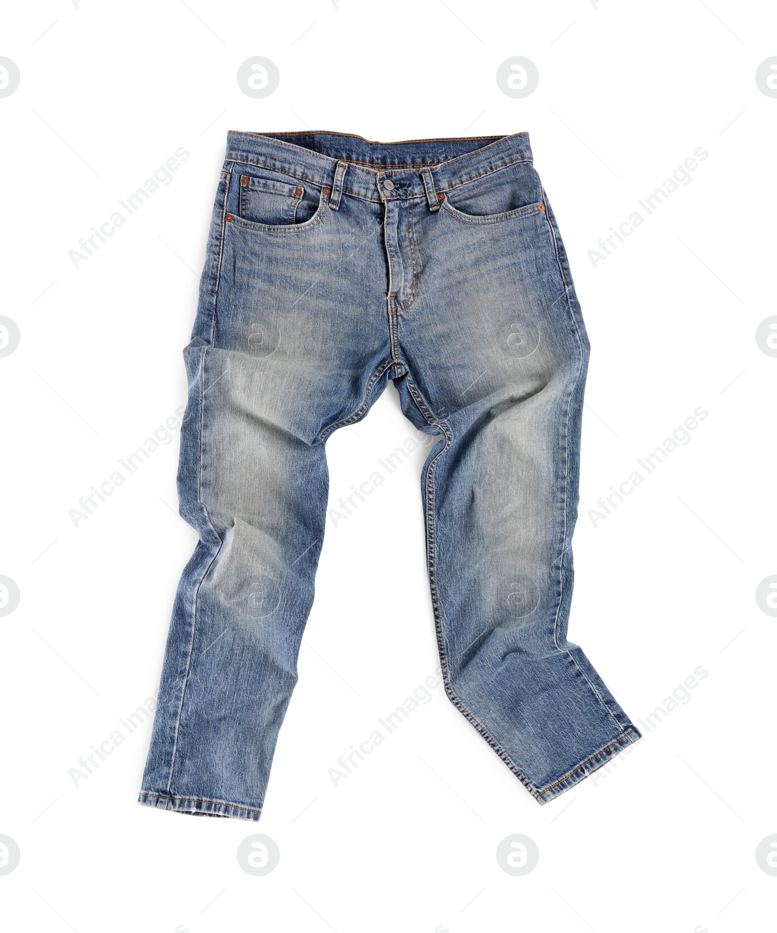 Photo of Rumpled blue jeans isolated on white, top view. Stylish clothes