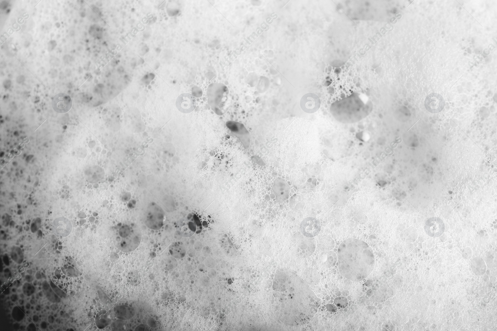 Photo of White foam with bubbles as background, top view