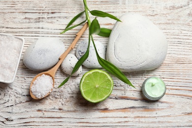 Photo of Flat lay composition with cosmetic products on wooden background