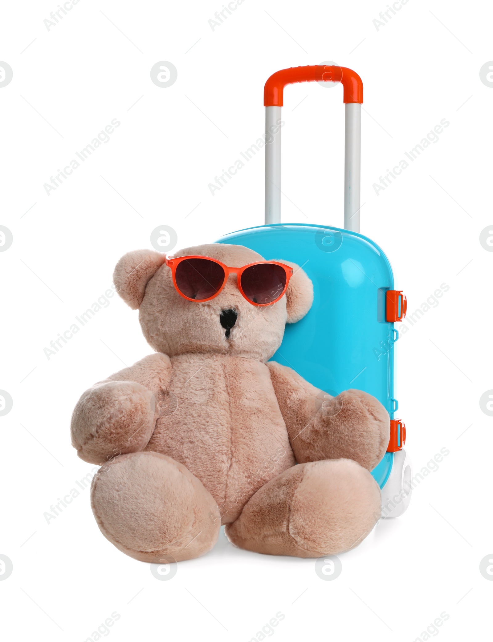 Photo of Composition with stylish little blue suitcase and teddy bear on white background