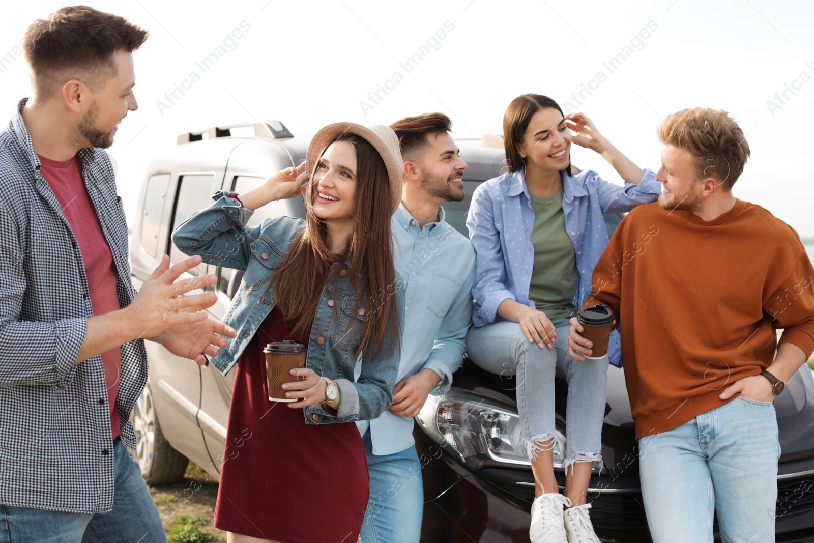 Photo of Group of happy people spending time together outdoors