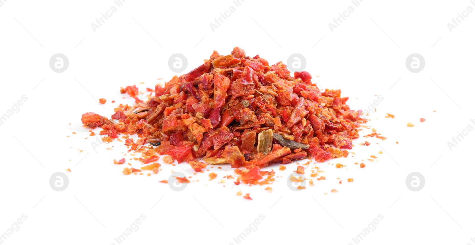 Photo of Aromatic spice. Pile of red chili pepper flakes isolated on white