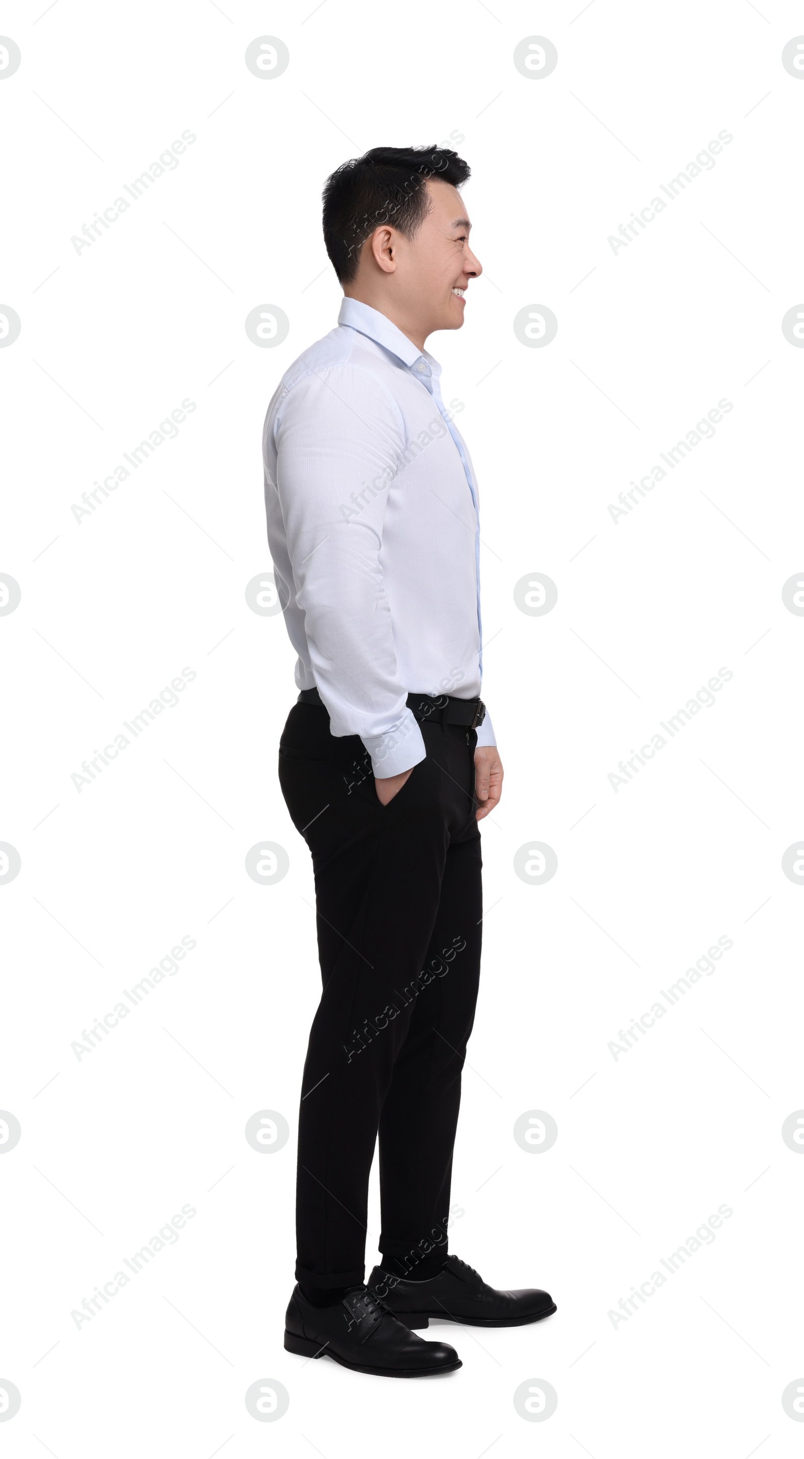 Photo of Businessman in formal clothes posing on white background