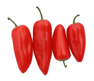 Photo of Fresh raw red hot chili peppers isolated on white, top view