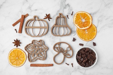 Photo of Flat lay composition with cookie cutters and spices on white marble table