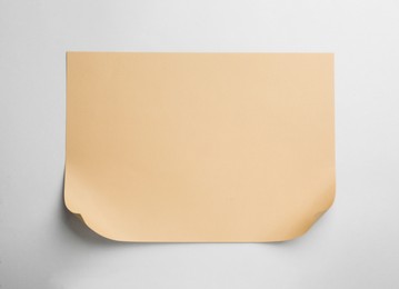 Photo of Sheet of brown paper on white background, top view