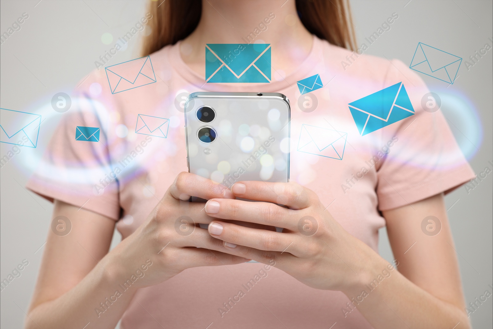 Image of Email. Woman using mobile phone on light background, closeup. Letter illustrations around device