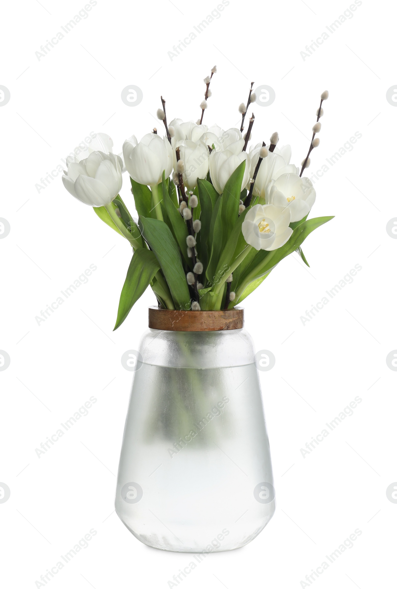 Photo of Beautiful bouquet of willow branches and tulips in vase isolated on white