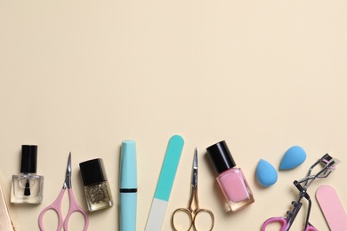 Flat lay composition with nail care products on beige background. Space for text