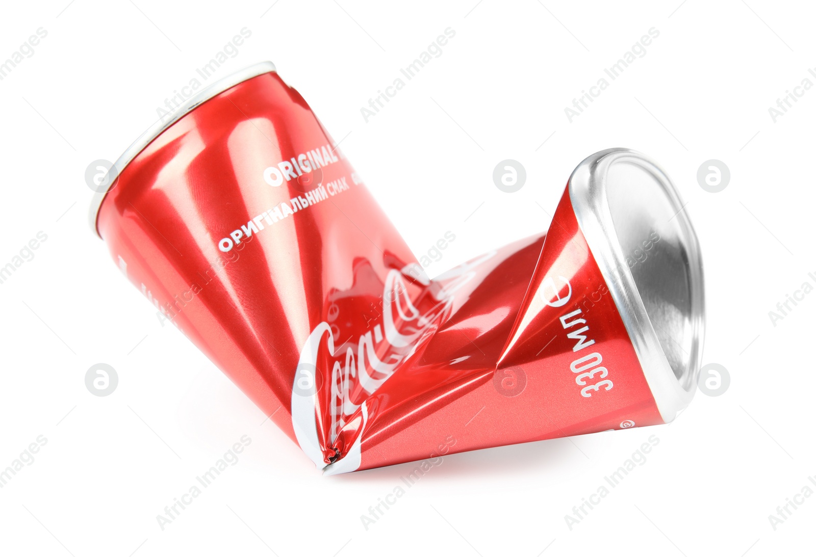 Photo of MYKOLAIV, UKRAINE - NOVEMBER 15, 2018: Crumpled Coca Cola can on white background