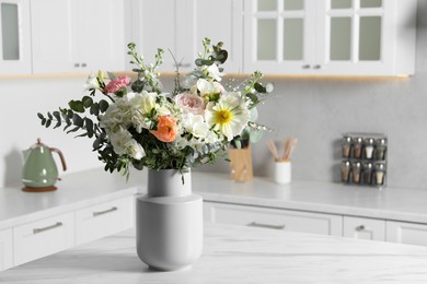 Photo of Bouquet of beautiful flowers on white table indoors. Space for text