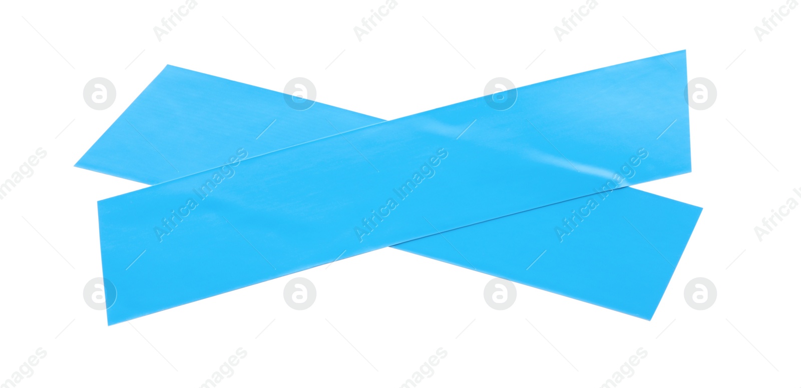 Photo of Crossed pieces of light blue insulating tape on white background, top view