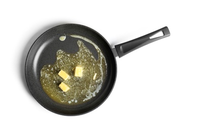 Photo of Frying pan with melting butter on white background, top view