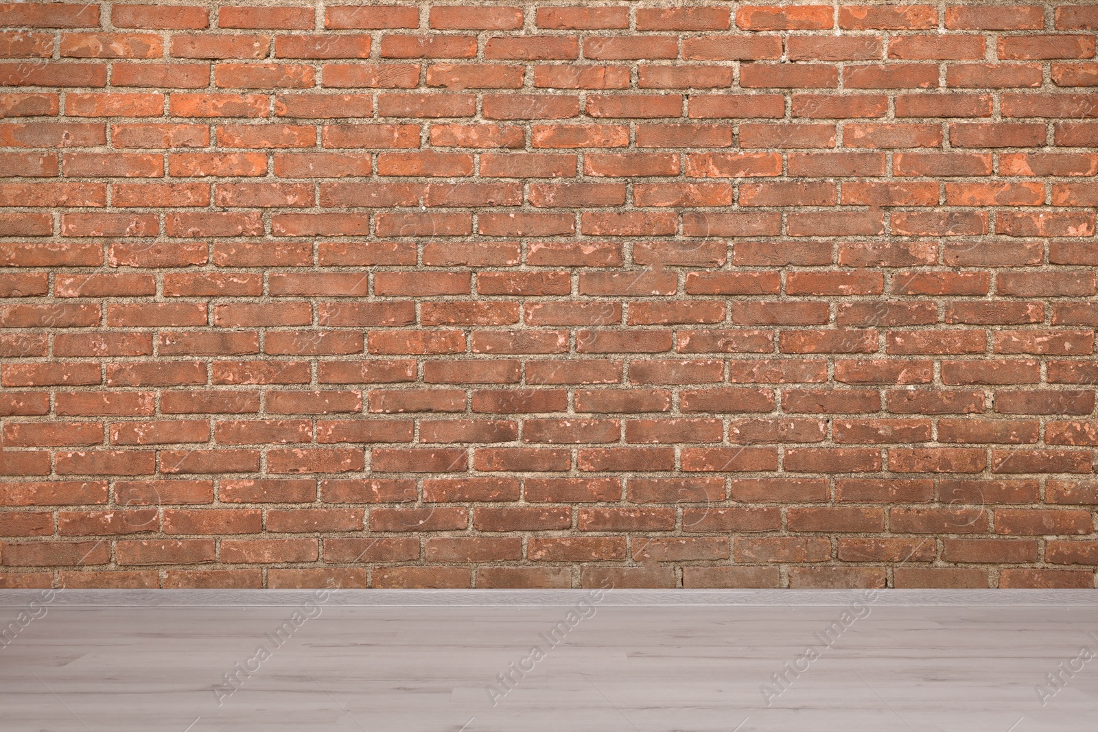 Image of Room with brick wall and wooden floor