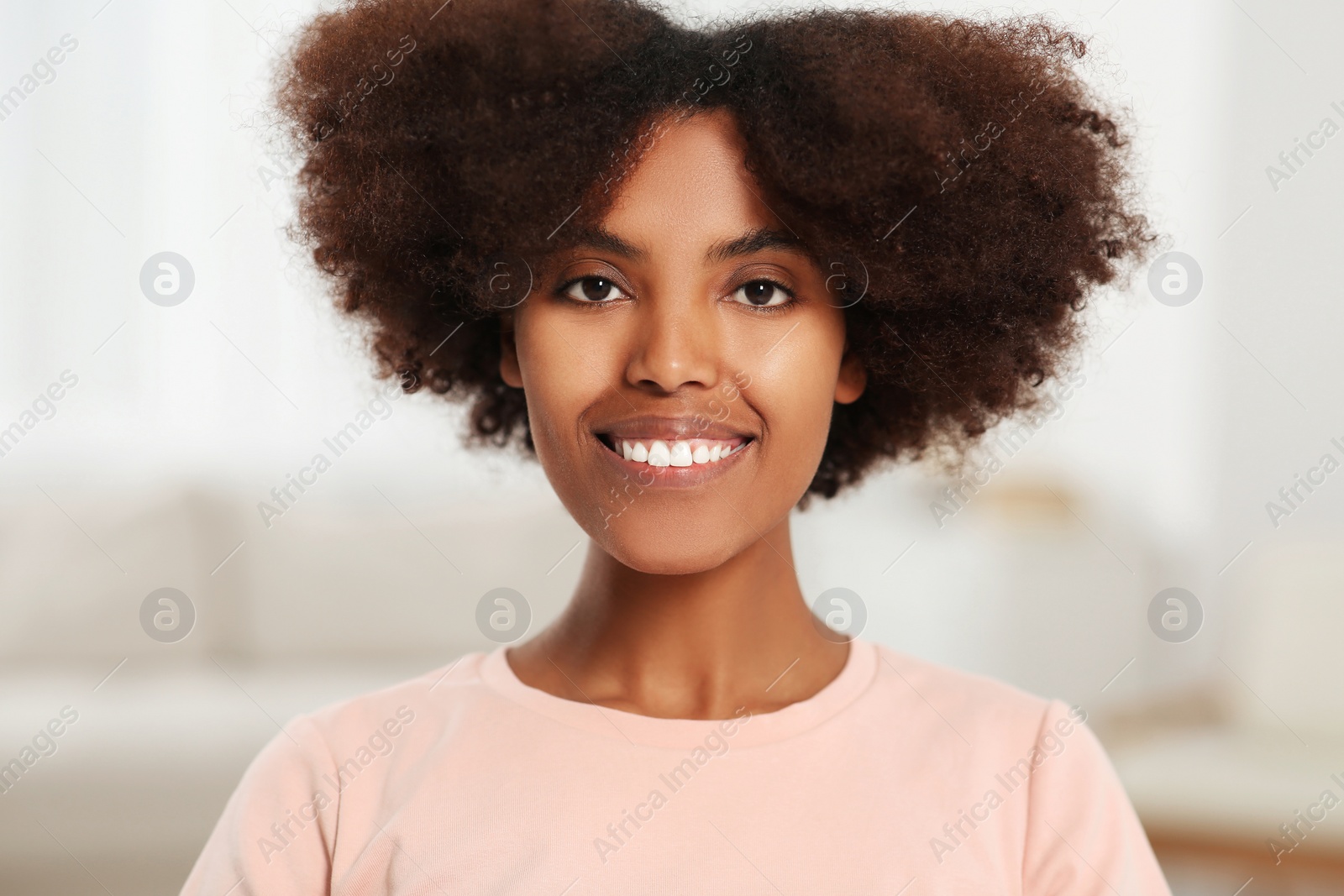 Photo of Portrait of smiling African American woman at home