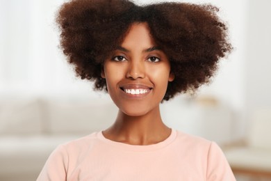 Photo of Portrait of smiling African American woman at home