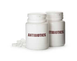 Image of Plastic bottles with antibiotic pills on white background
