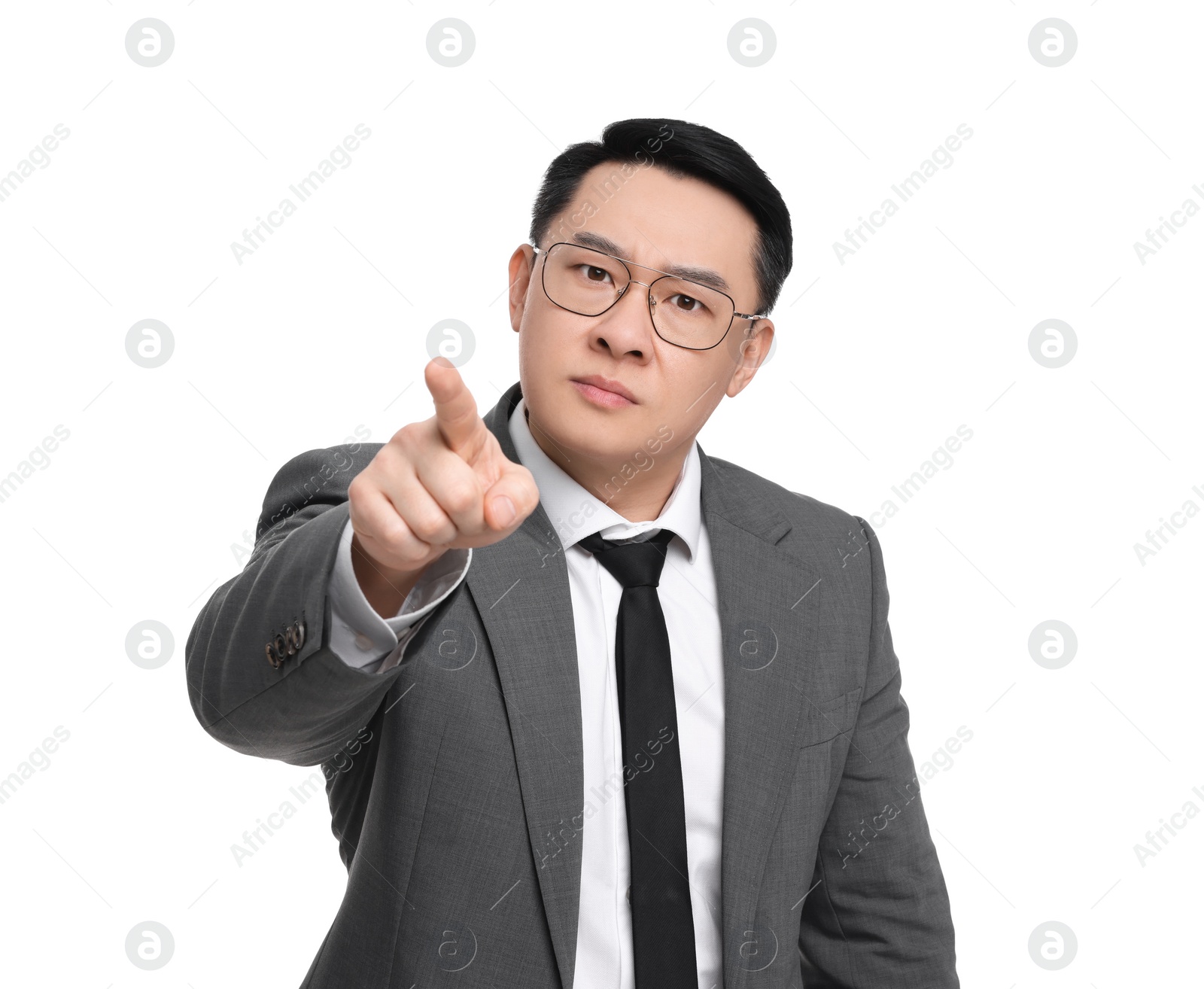 Photo of Angry businessman in suit posing on white background