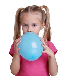 Photo of Cute little girl inflating light blue balloon on white background