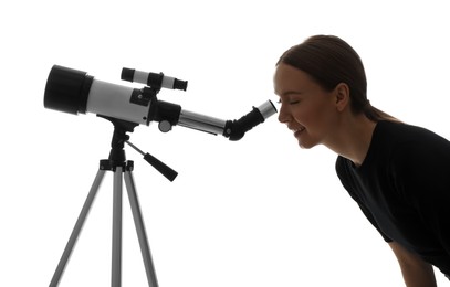 Young astronomer looking at stars through telescope on white background