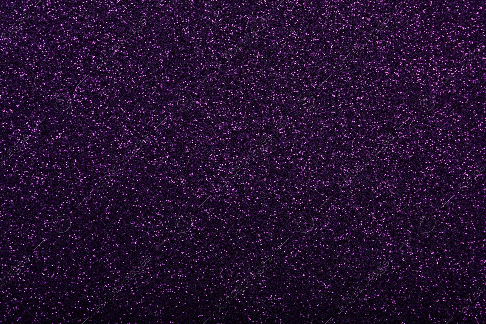 Photo of Shiny dark purple glitter as background, closeup