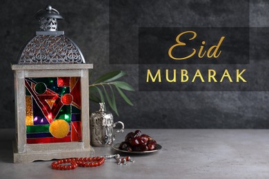Image of Eid Mubarak greeting card. Composition with Arabic lantern and misbaha on grey table