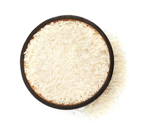 Plate with uncooked rice on white background, top view