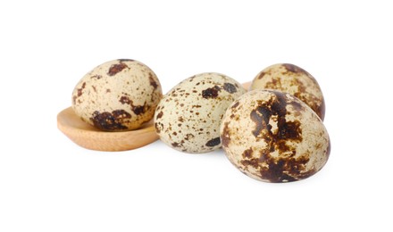 Photo of Wooden spoon and quail eggs on white background