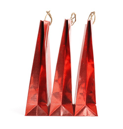 Red paper shopping bags isolated on white