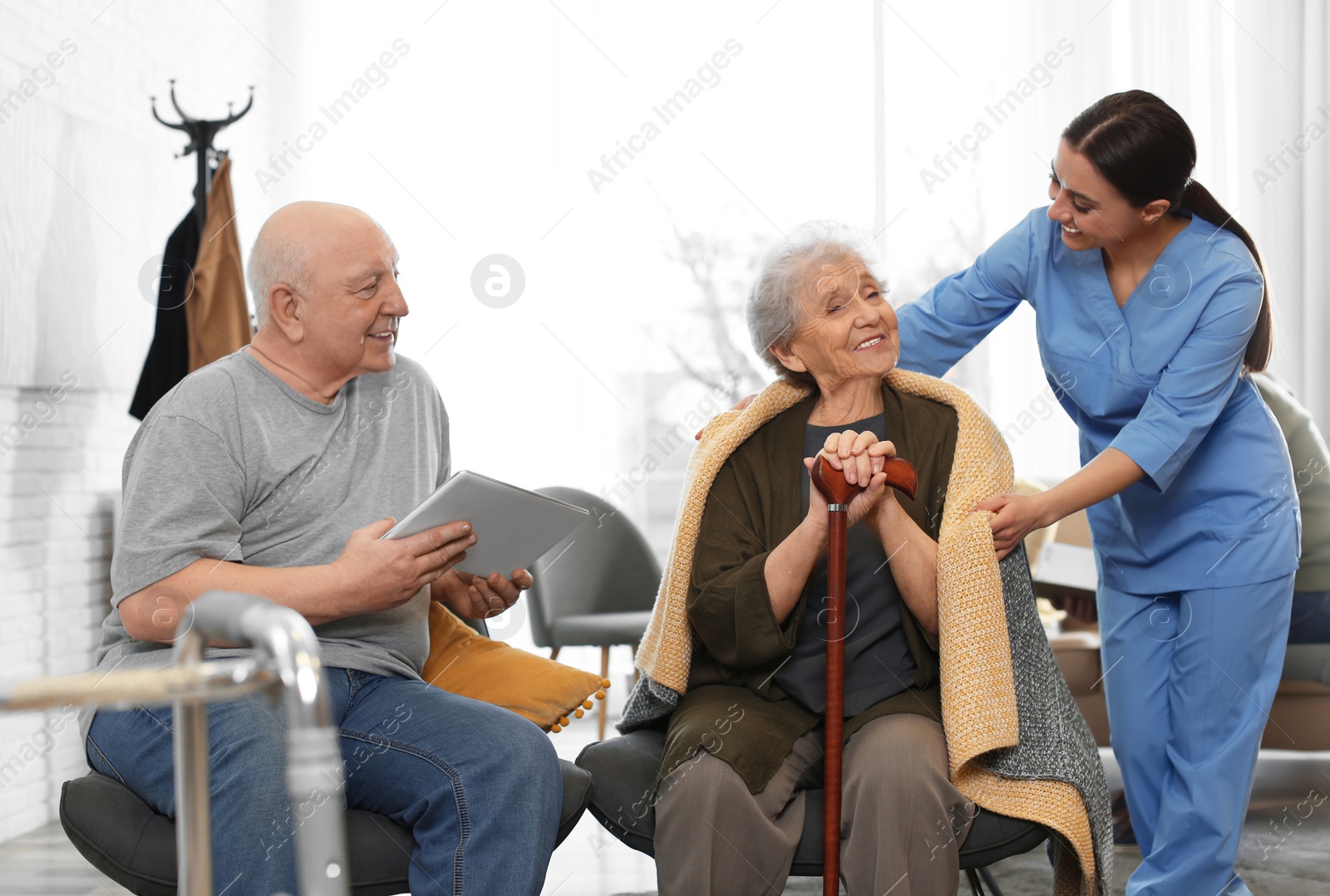 Photo of Nurse taking care of elderly patients in geriatric hospice