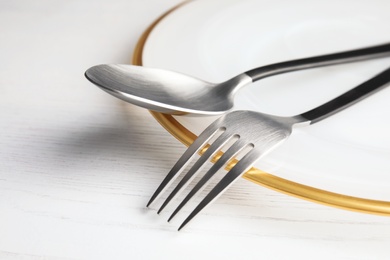 Photo of Elegant table setting on light background, closeup