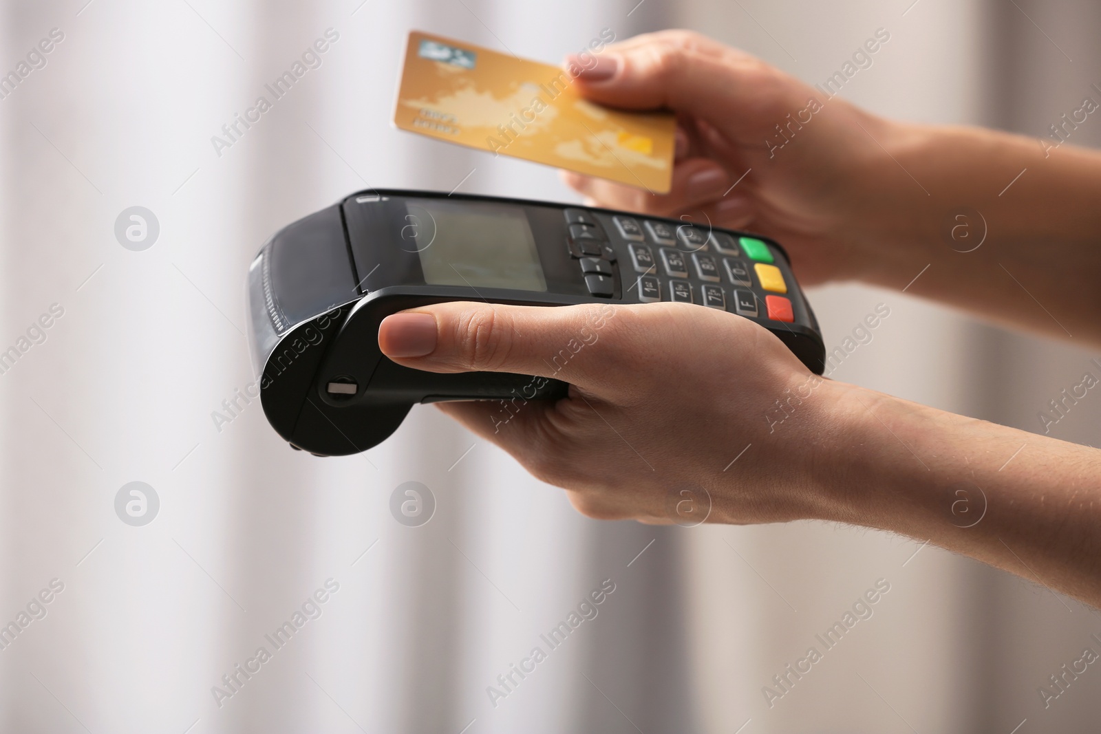 Photo of Woman using modern payment terminal indoors, closeup