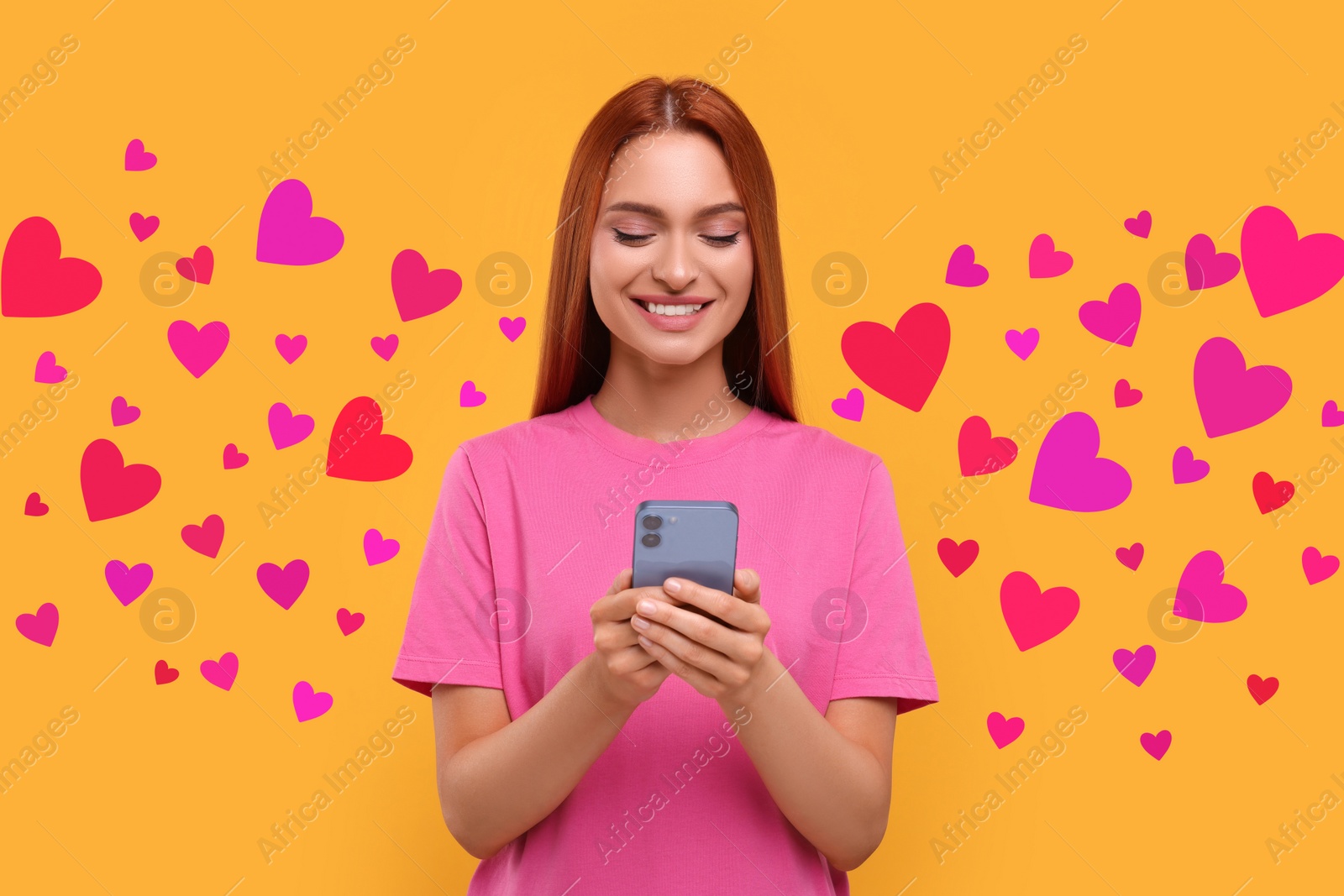 Image of Long distance love. Woman chatting with sweetheart via smartphone on golden background. Hearts flying out of device and swirling around her