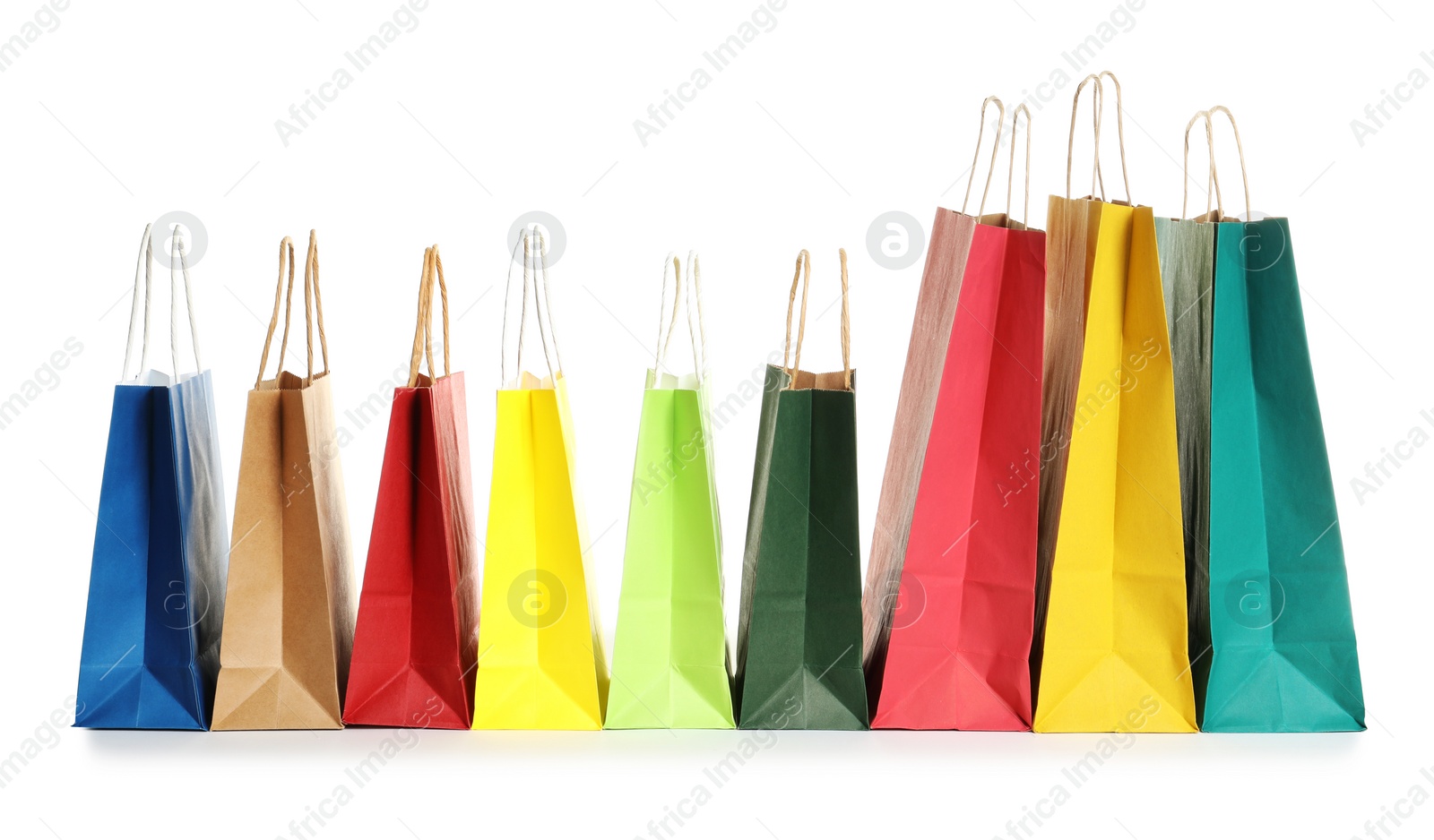 Photo of Colorful paper shopping bags on white background