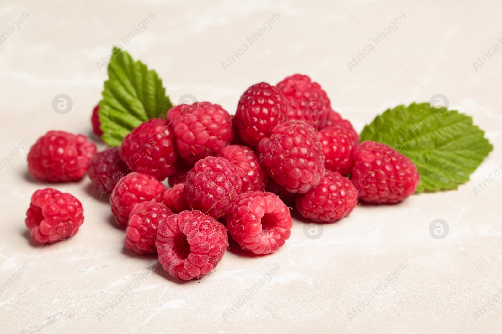 Photo of Ripe aromatic raspberries on table, closeup