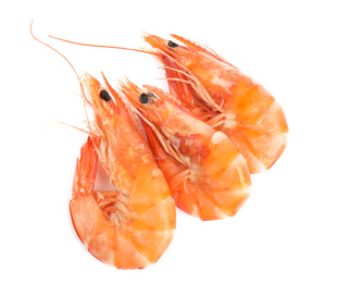 Delicious cooked shrimps isolated on white, top view