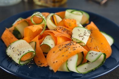 Plate with tasty carrot salad, closeup