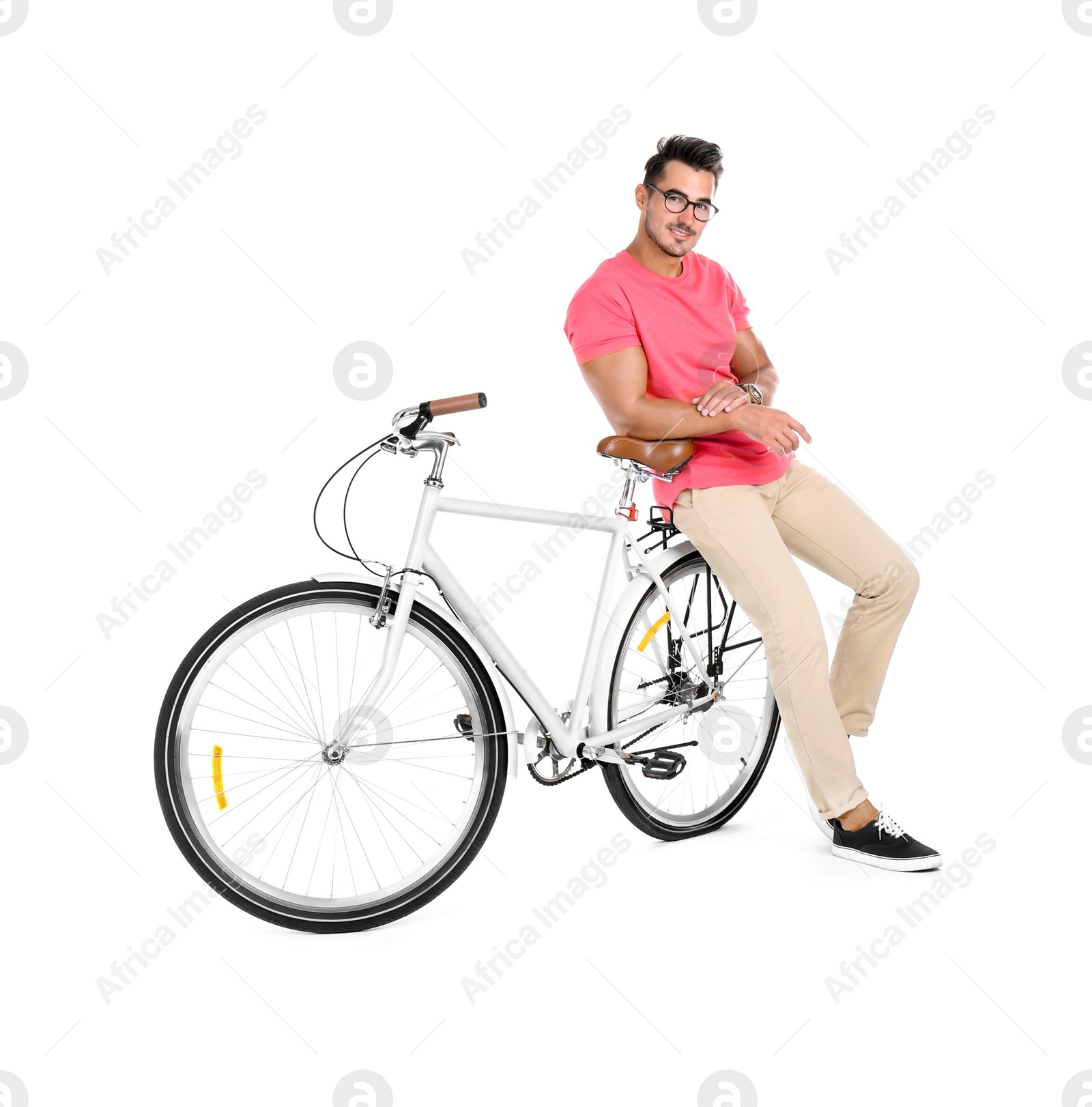 Photo of Handsome young hipster man with bicycle on white background