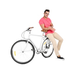 Handsome young hipster man with bicycle on white background