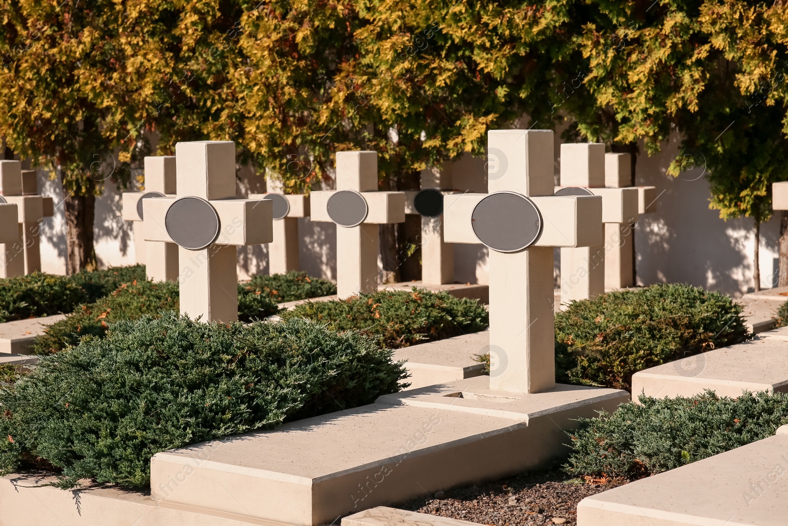 Photo of Many granite tombstones at cemetery. Religious tradition