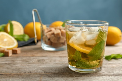 Photo of Composition with delicious mint julep cocktail on table