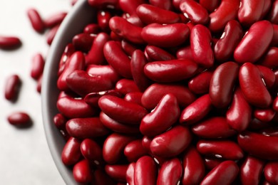 Photo of Raw red kidney beans in bowl, top view