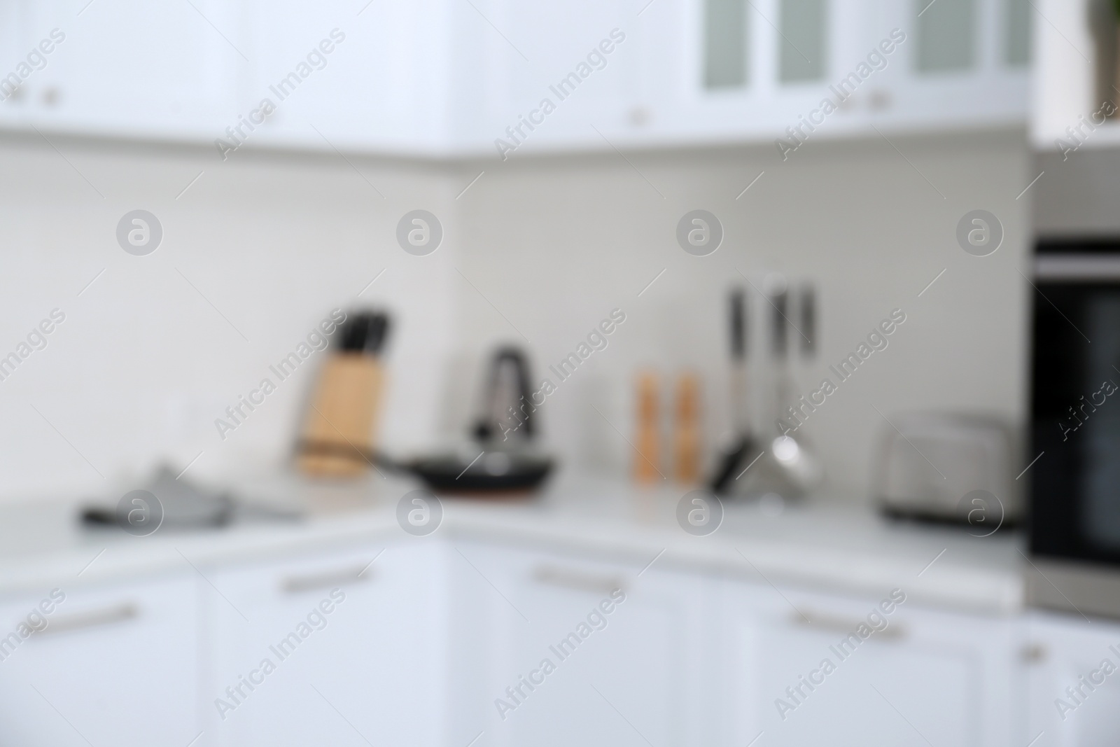 Photo of Blurred view of modern stylish kitchen interior