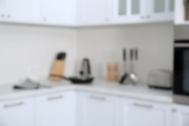 Photo of Blurred view of modern stylish kitchen interior