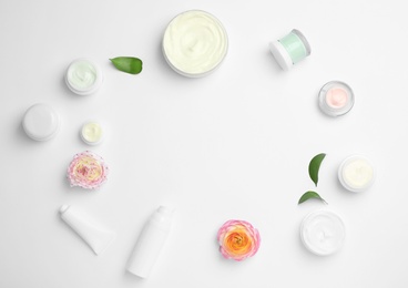 Photo of Flat lay composition with cosmetic products on light background