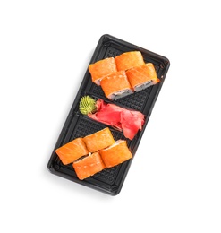 Photo of Box with tasty sushi rolls on white background, top view. Food delivery