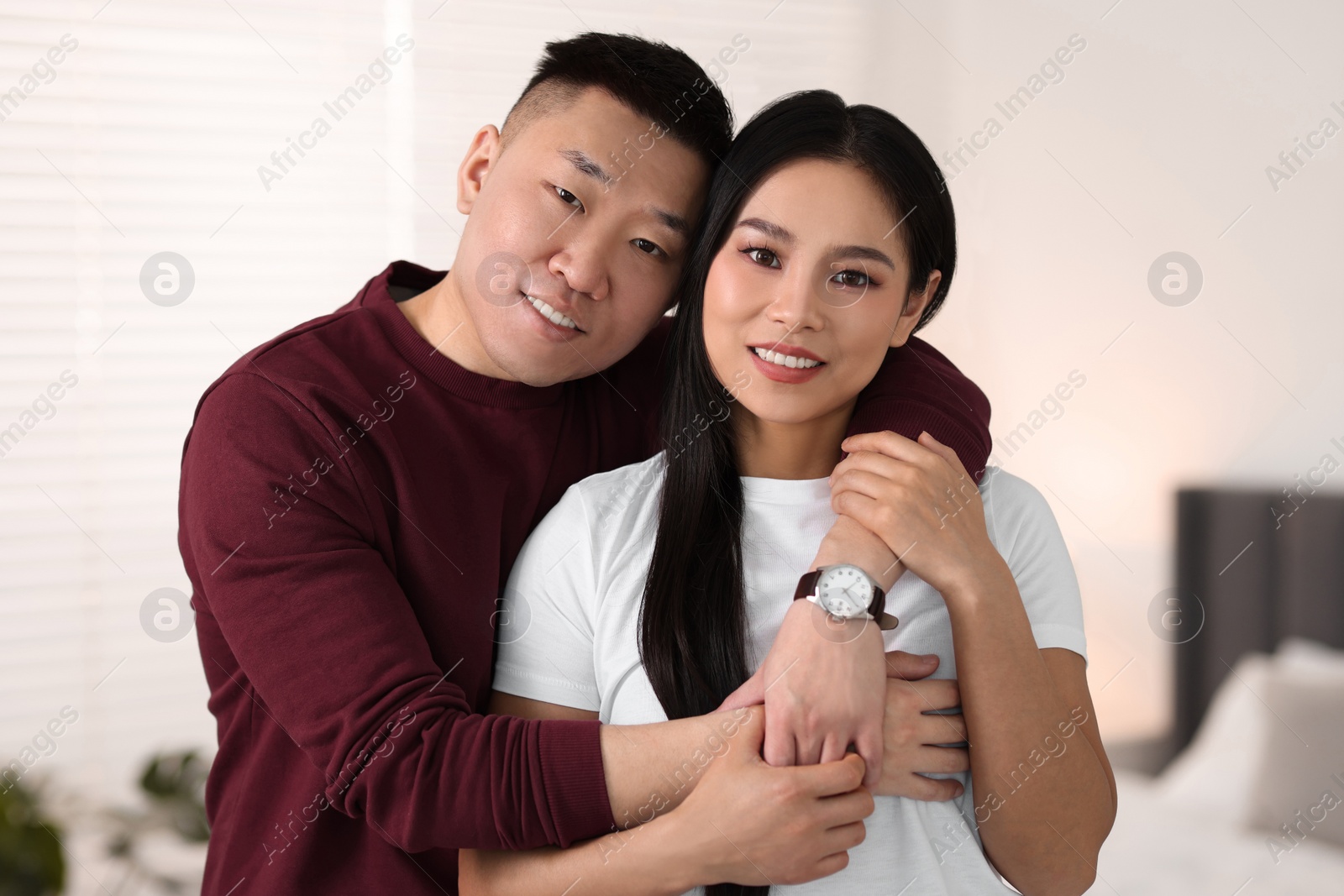 Photo of Portrait of lovely young couple at home