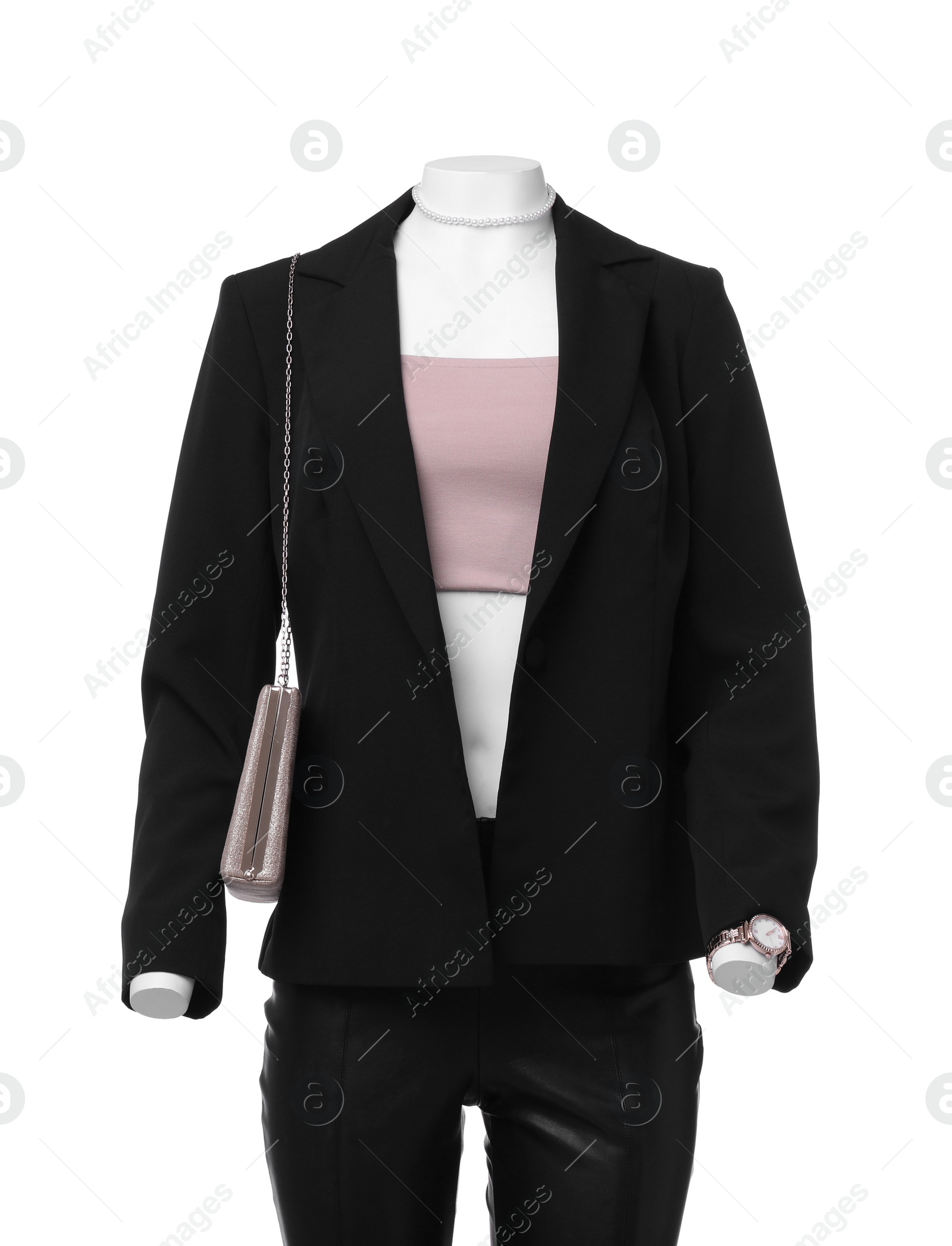 Photo of Female mannequin dressed in black suit and crop top with accessories isolated on white. Stylish outfit